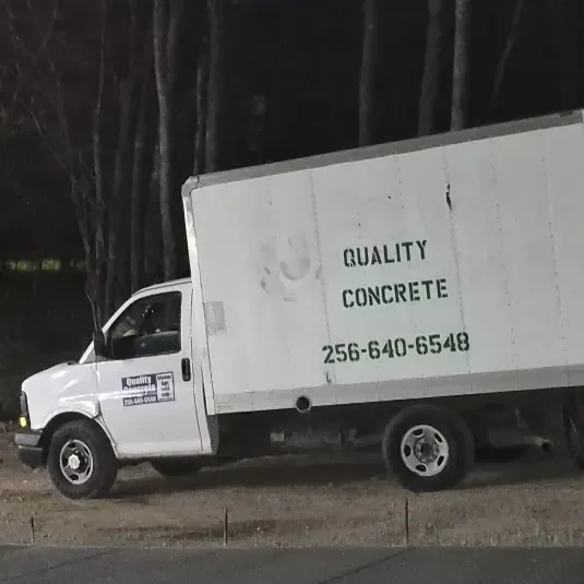 Quality Concrete box truck lettered with the company name and phone number 256-640-6548