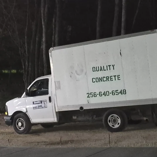 Quality Concrete box truck lettered with the company name and phone number 256-640-6548